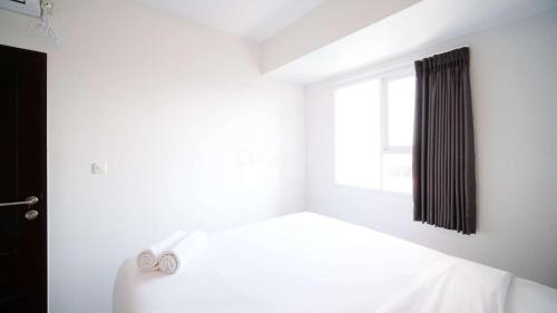Sidoarjo Apartment | Comfy and Spacey 2BR Apartment at Suncity Residence By Travelio