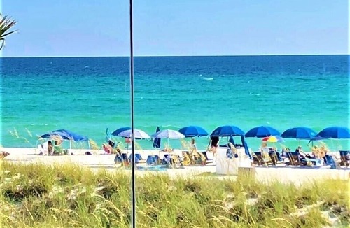 Panama City Beach Condo | Complimentary Beach Loungers WiFi Sleeps 4