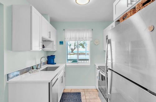 Anna Maria House | Coquina Cottage A by Duncan Real Estate