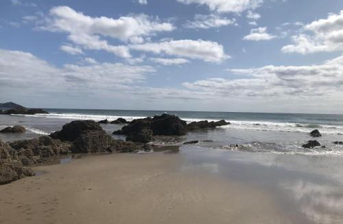 Widegates House | Corn Barn at East Trenean Farm -Luxury Cornish Barn Conversion sleeping 8 with hot tub, private garden, rural views and EV facilities