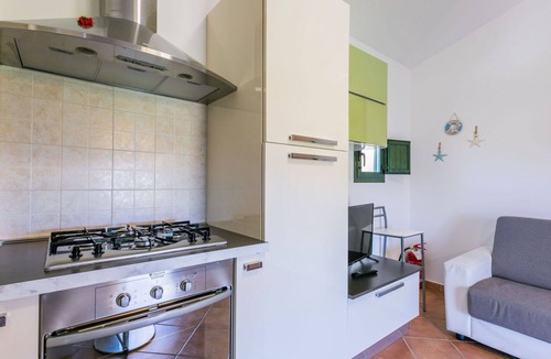 Castellina Marittima Apartment | Cosy apartment for 2 guests with A/C, pool, WIFI, TV, balcony and pets allowed