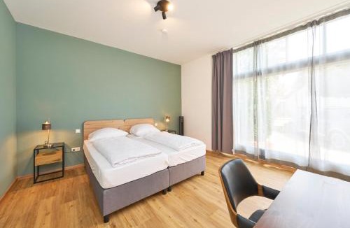 Munchen District Apartment | COZEE - Moderne Design-Apartments I Parkplatz I Ideal für München & Flughafen MUC
