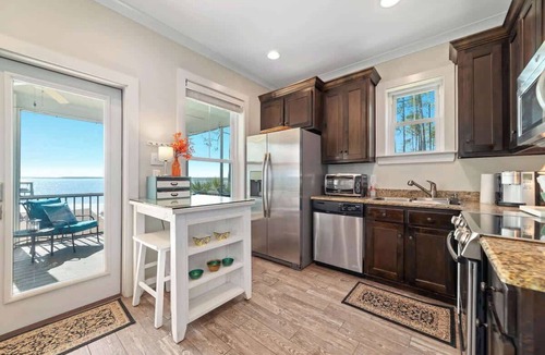Elberta Cottage | Cozy Bayfront Guest Cottage - Boat Friendly Dock!