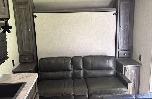 Dawson County House | Cozy camper with queen Murphy bed, bunks, and dinette conversion bed.