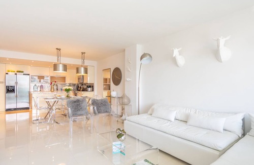 Sunny Isles Beach Condo | Cozy designer condo across from the beach. WiFi, parking, tennis and more!