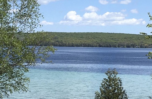 Kewadin Cottage | Cozy family cottage on lake; private, quiet retreat available for monthly rental