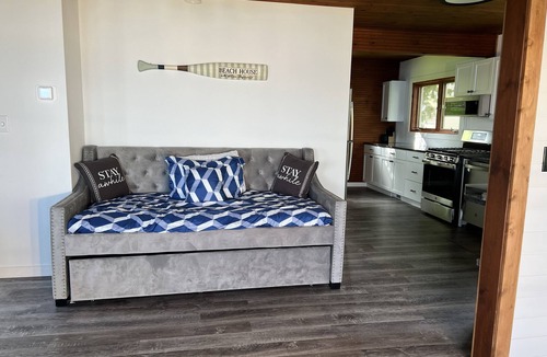 Shawano Cottage | Cozy Lakefront Cottage — Sunsets, Kayaks, Fishing, Paddleboards, Water Mat