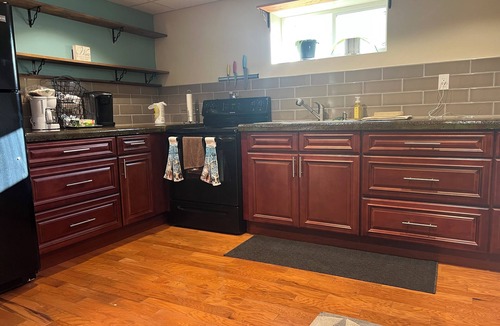 Phoenix House | Cozy Oswego River Area Basement Suite Sunroom & Hot Tub in Phoenix NY
