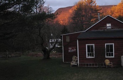 Saugerties House | Cozy, quiet, stream-side 1850s farmhouse with meadow, garden and mountain views