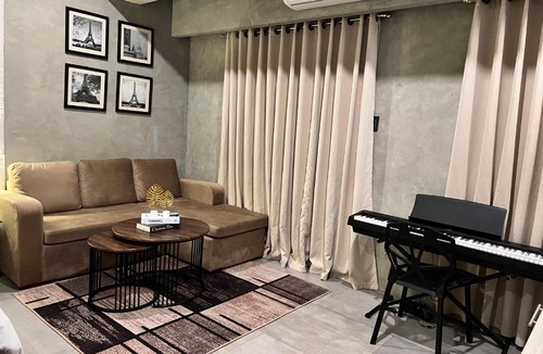 Kaunlaran Apartment | Cozy Spacious Hotel Type Condo with Smart TV and WiFi
