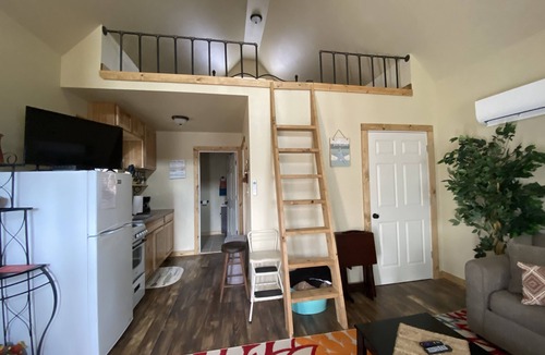 Winslow House | Cozy tiny cabin nestled in a little woodland village – playground, pond and more