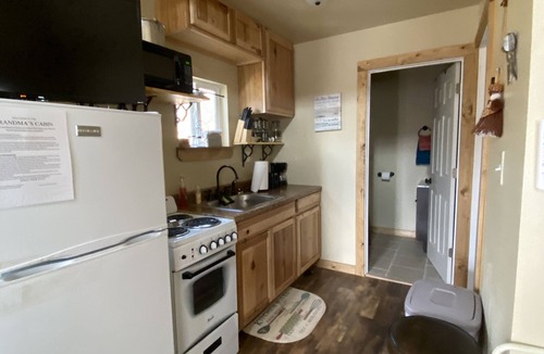 Winslow House | Cozy tiny cabin nestled in a little woodland village – playground, pond and more