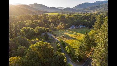 Murphy Other | Cozy Wild West Covered Wagon next to River