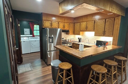 Iuka Cottage | Cozy woodland retreat with modern comforts and rustic charm.
