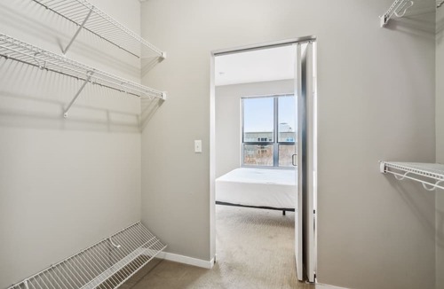 Mill District Apartment | CozySuites Mill District with pool, gym # 09