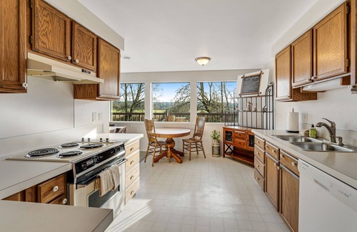 Lacey House | Creekside charmer with kayaks, fireplace, large deck, & W/D - dog-friendly