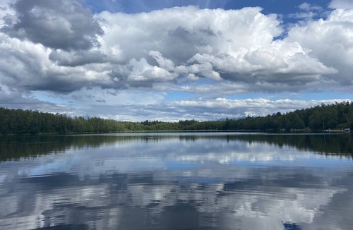 Tanaina Cabin | Custom built modern cabin with a loft on a lake with mountain views.