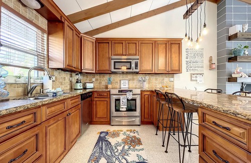 Whitney Beach House | Cute canal front Cottage with dock & boat lift and pool ,short walk to the beach