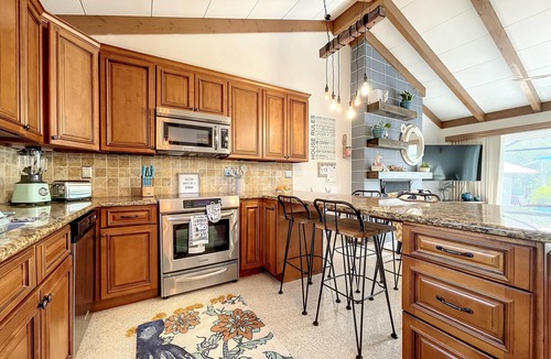 Whitney Beach House | Cute canal front Cottage with dock & boat lift and pool ,short walk to the beach
