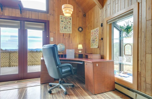 Vernon Apartment | Deck, Mountain Views: Colorful Retreat in Vernon!