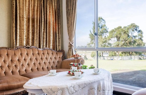 Woodville House | Dei Gratia High Tea House, 11A Loch Goyle Dr, Woodville - a quirky retreat with linen, aircon and Wi-Fi