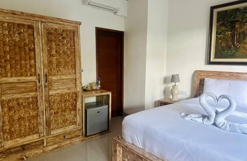 Pengosekan Bed & Breakfast | Deluxe Double Room with Balcony at Mandala Home Stay