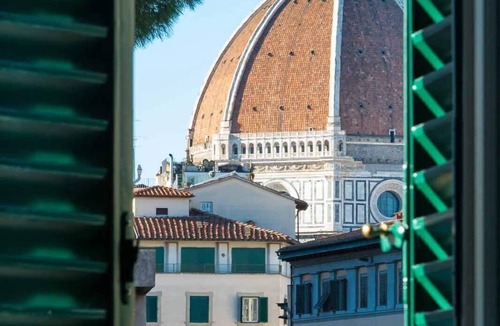 Sant' Ambrogio Apartment | Deluxe suite with great view! Bed and view in the heart of Florence.