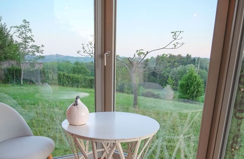San Maurizio House | Dependance Rose, a romantic living room with double bed and bathroom