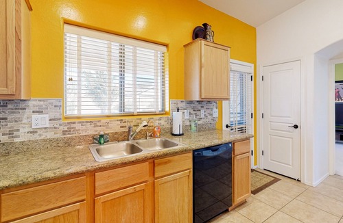 Power Ranch House | Desert oasis with an enclosed yard, firepit, washer/dryer, and central AC