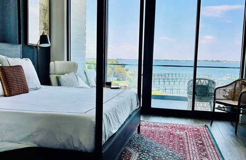 Interchange Square Condo | Designer three bedroom three bath condo with expansive river and pool views