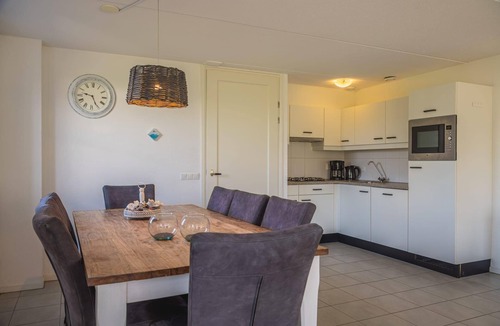 Amsterdam House | Detached bungalow with a patio with garden furniture and a private parking space