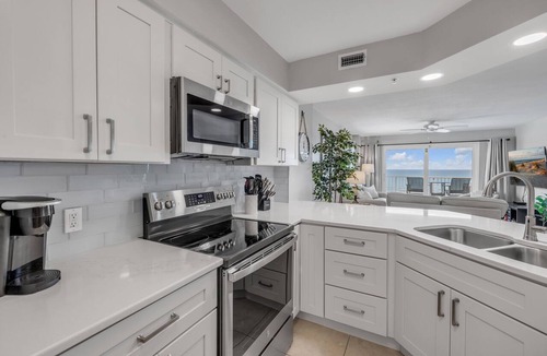 Seawinds Condo Condo | Direct oceanfront penthouse 2/2 with gorgeous corner condo views, a heated pool, and garage