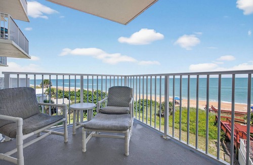 Seawinds Condo Condo | Direct oceanfront 2/2 condo with a private balcony, heated beachfront pool, and garage
