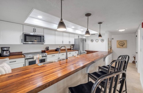 Ormond-by-the-Sea Condo | Direct oceanfront corner condo with big balcony, heated beachfront pool and garage parking