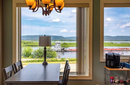 Minneiska House | Discover ‘Riverview Radiance,' a 5BR Minneiska marvel where the Mississippi meets modern luxury. Perfect for large groups, this home boasts a fully-equipped kitchen, sprawling views, and a suite of entertainment options. Revel in comfort with plush