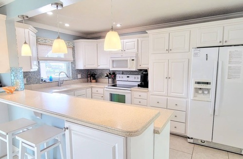 Cocoa Isles House | "Dive Into Fun! Spring & Summer Deals at Dolphin Cove – Walk to It All!"