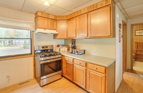 Gould City Cottage | Dock & Fire Pit: Lakefront Cottage in Gould City!