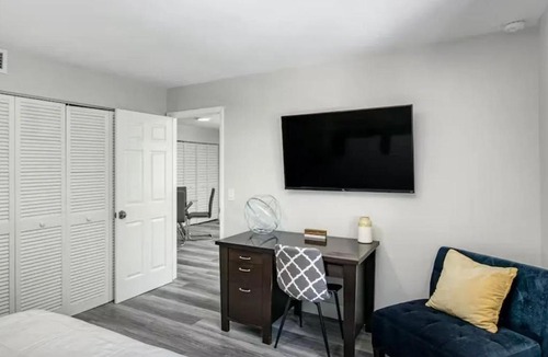 Palm Beach Shores Apartment | Dog friendly condo with beach access, hot tub & firepit
