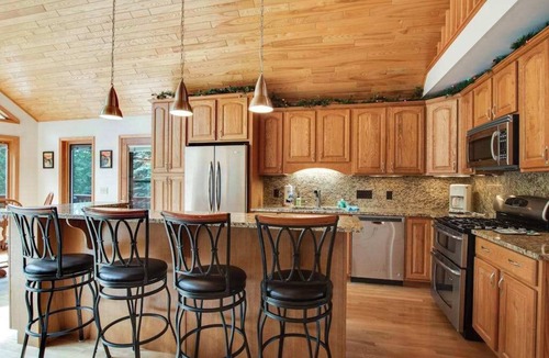 Eagle River House | Dog-friendly lakefront getaway with dock, firepit, wet bar, game room, & AC