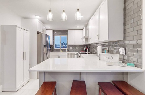 Isles of Capri Condo | Dog-friendly single-level condo with furnished patio, rooftop, & washer/dryer