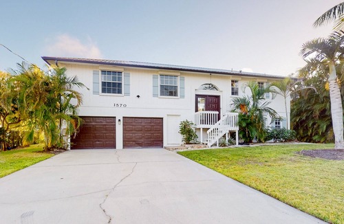 Redevelopment Area House | Dog-friendly waterfront home with extensive deck, canal views, lawn, W/D, AC