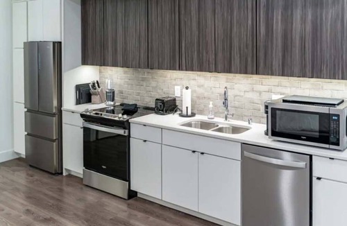 Appleton Apartment | Downtown! Brand New, Modern, Massive Studio with Kitchen + Game Room & Theater.