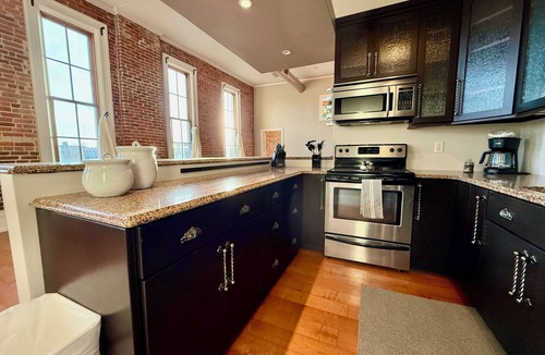 Cedar Falls Apartment | Downtown CF Retreat: King Beds, Brewery Below!