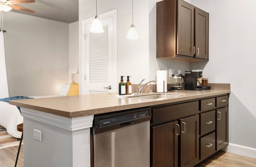 Lawrence Apartment | Downtown Lawrence Condo 1 Block to Mass St Walk to KU Hot Tub Sleeps 4