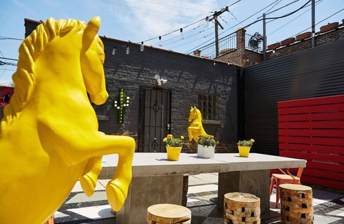 Logan Square House | El Motel United in Logan Square that Sleeps 24 with Large Entertaining Patio + Grill