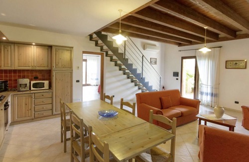 Santa Maria La Palma Apartment | Elegant 130 square meter residence on two levels, at ground floor, perfect for groups of up to 9 guests.Four bedrooms with double or twin beds (one with an extra bed). It features two bathrooms, a spacious living room, and a fully equipped kitchen.A priv