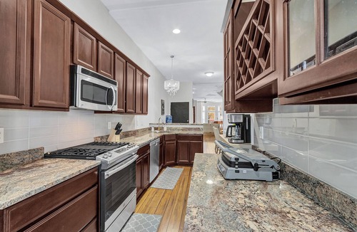 Old Goucher House | Elegant 3 bedroom Row Home Beside the Park High Ceilings, Natural Light & Views.