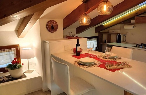Levico Terme Apartment | Elegant attic with Dolomites view, relaxation and nature in Levico Terme.