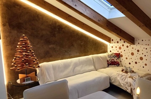 Levico Terme Apartment | Elegant attic with Dolomites view, relaxation and nature in Levico Terme.