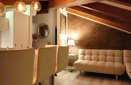 Levico Terme Apartment | Elegant attic with Dolomites view, relaxation and nature in Levico Terme.